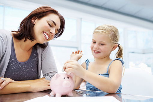 Woman and daughter learning about personal banking